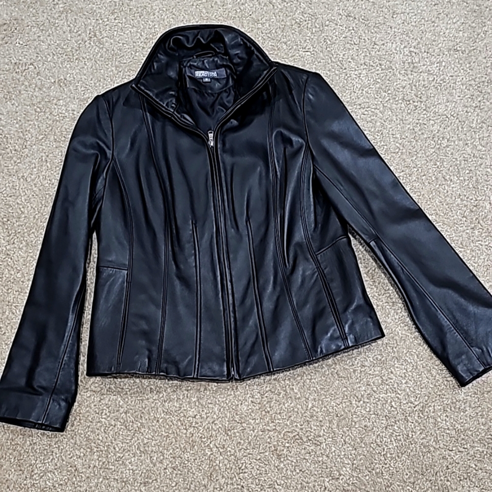 Kenneth Cole Reaction Black leather jacket in size medium.  Measures 24 inches.